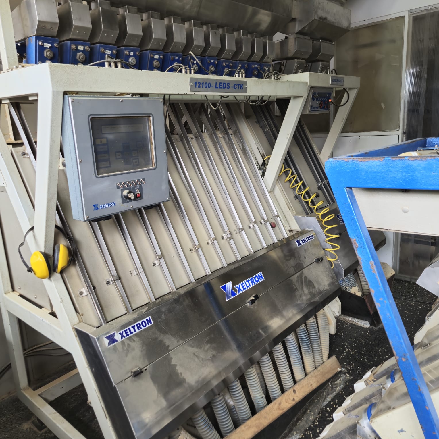Optical sorting machine grading green coffee at the Invercafé mill