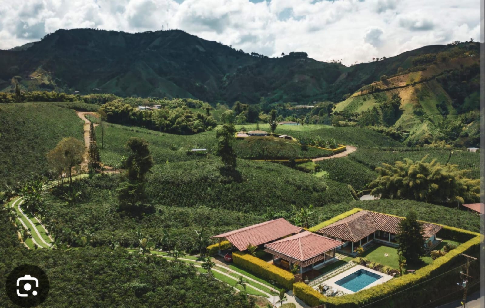 Aerial view of an Invercafé coffee farm and farmhouse in the Colombian mountains